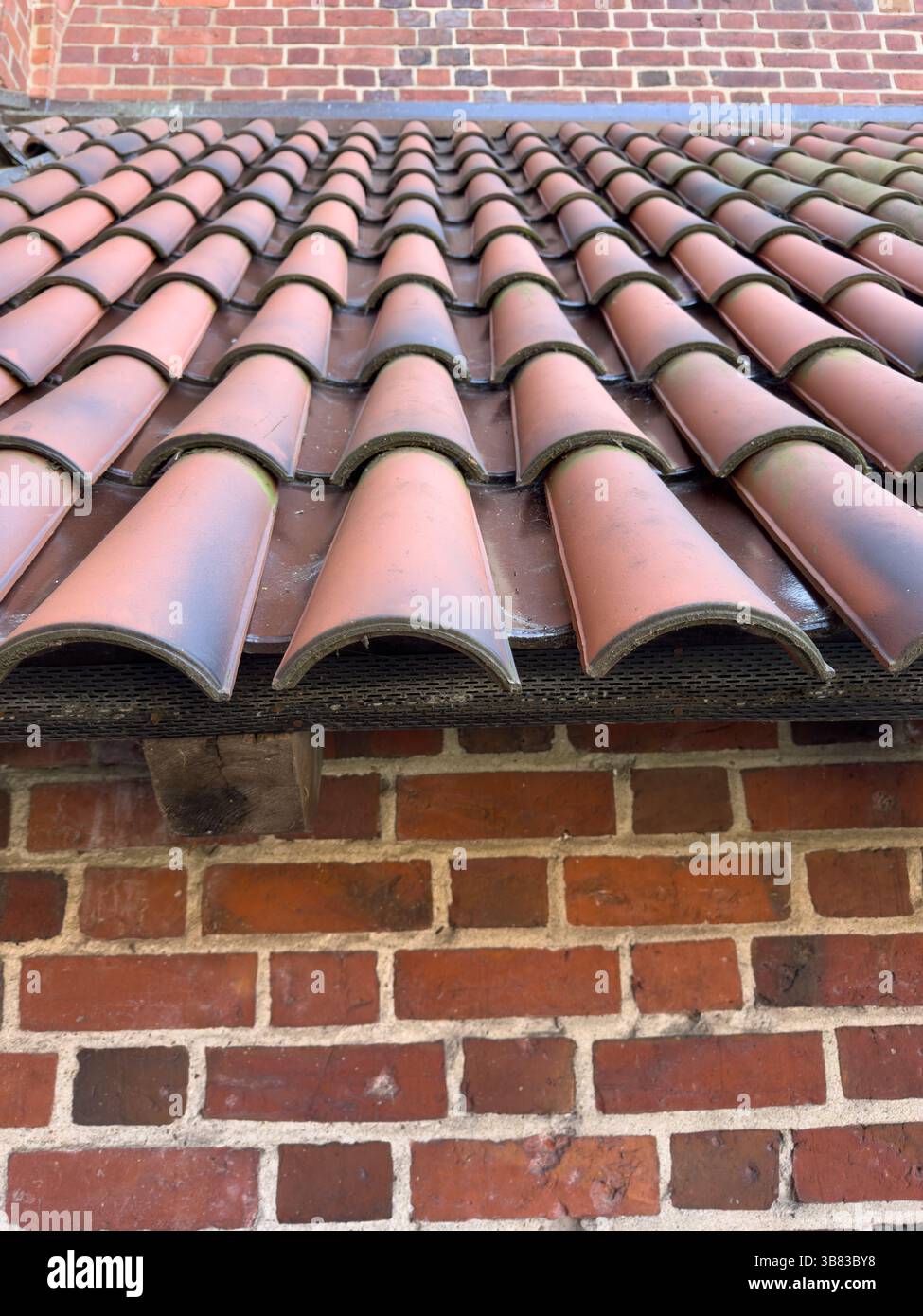 Rustic terracotta roof tiles, showcasing traditional European architectural beauty - Smartphone Captured Stock Image