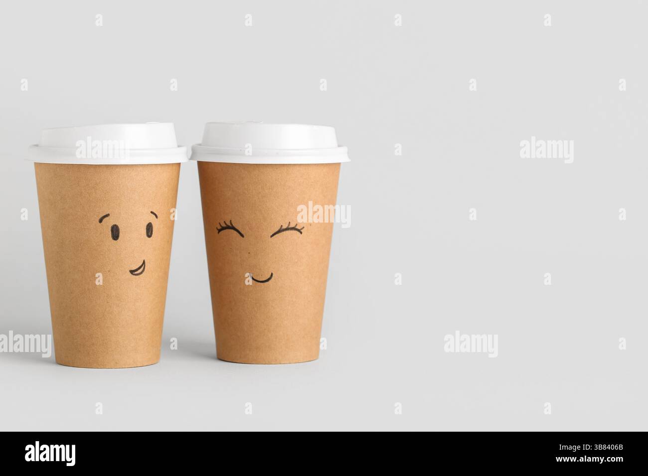 Funny paper cups with drawn faces on grey background. Friendship Day ...