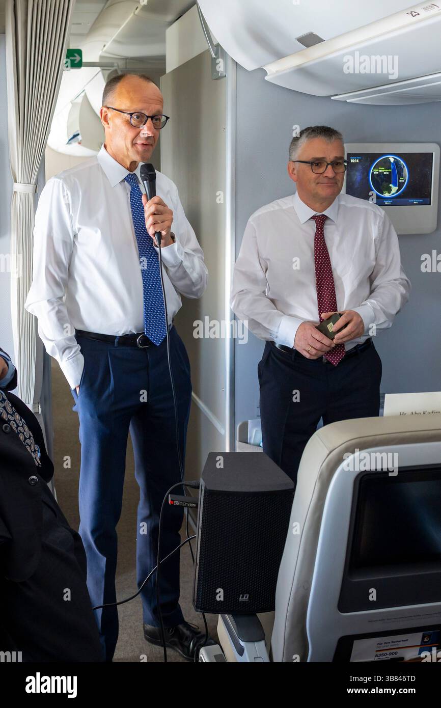 Chancellor Friedrich Merz (CDU) speaks with journalists aboard an