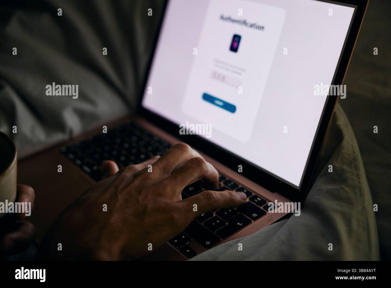 Hand of woman typing on laptop in bedroom at home Stock Photo