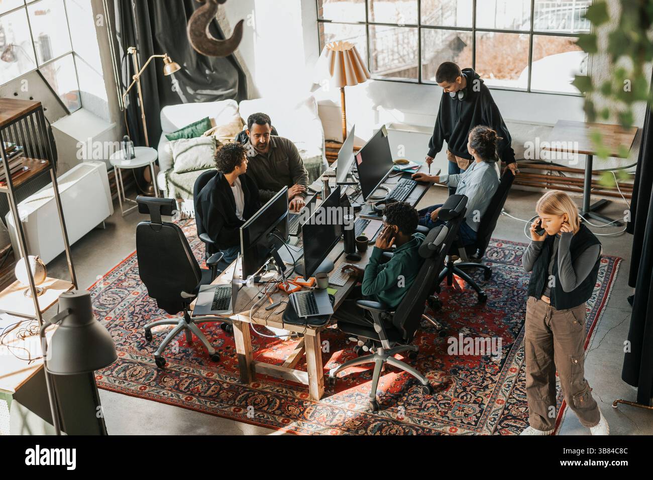 High angle view of computer programmers working in tech startup office Stock Photo