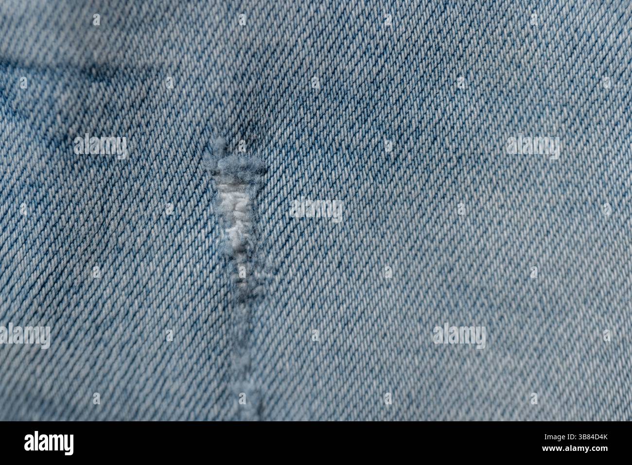 Light Denim Texture Jeans With Torn Stock Photo