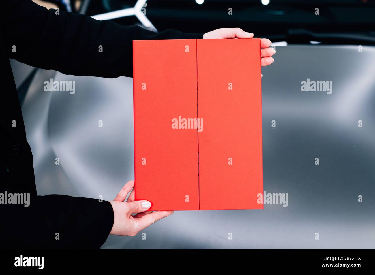 Red diploma award in hands. High quality photo Stock Photo