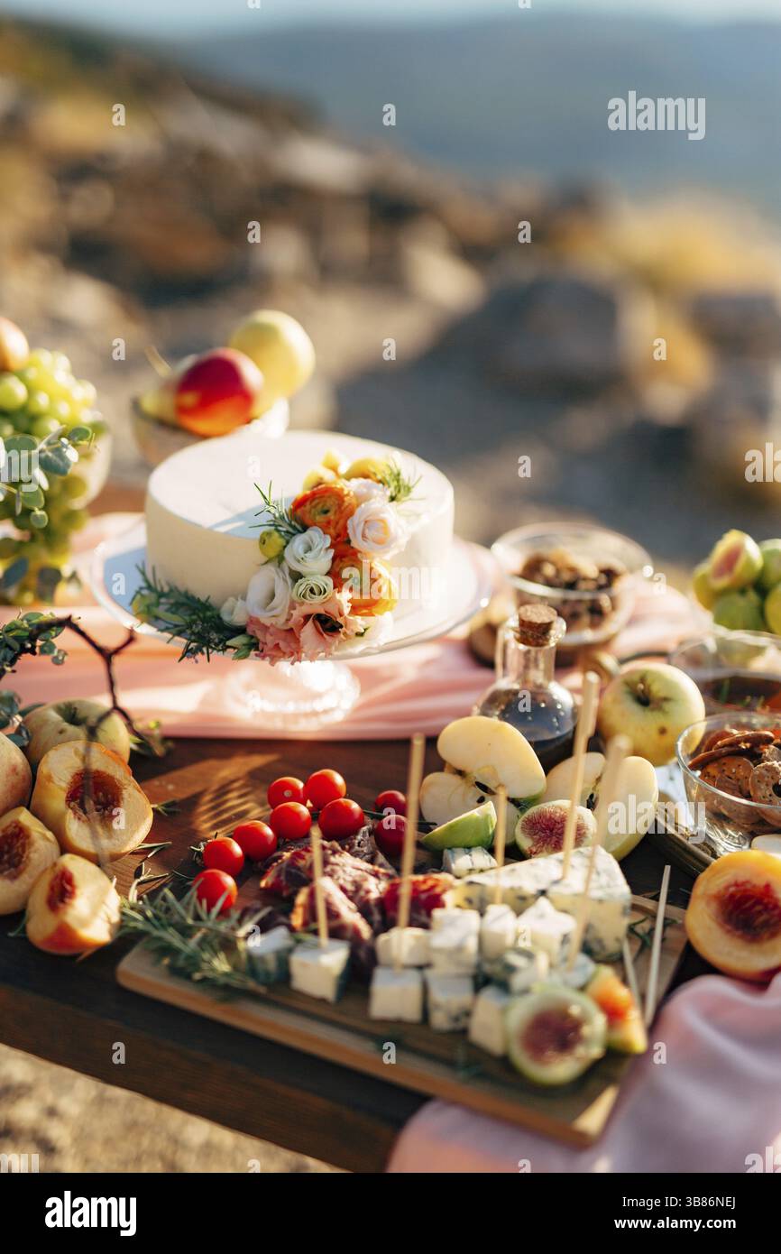 White wedding cake on a set table. Stock Photo