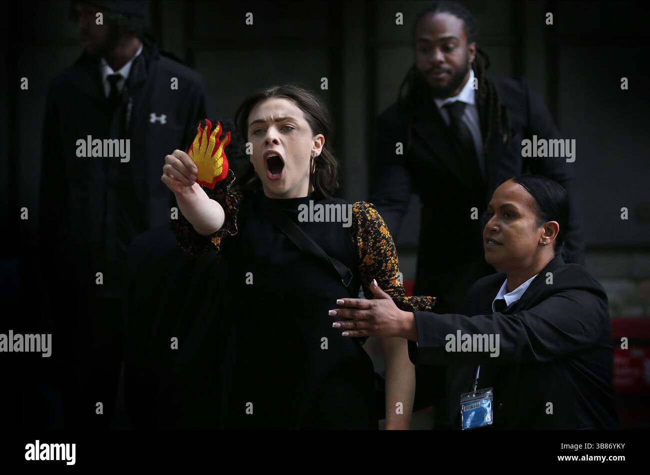 London, England, UK. 7th May, 2025. A climate protester shows the ...