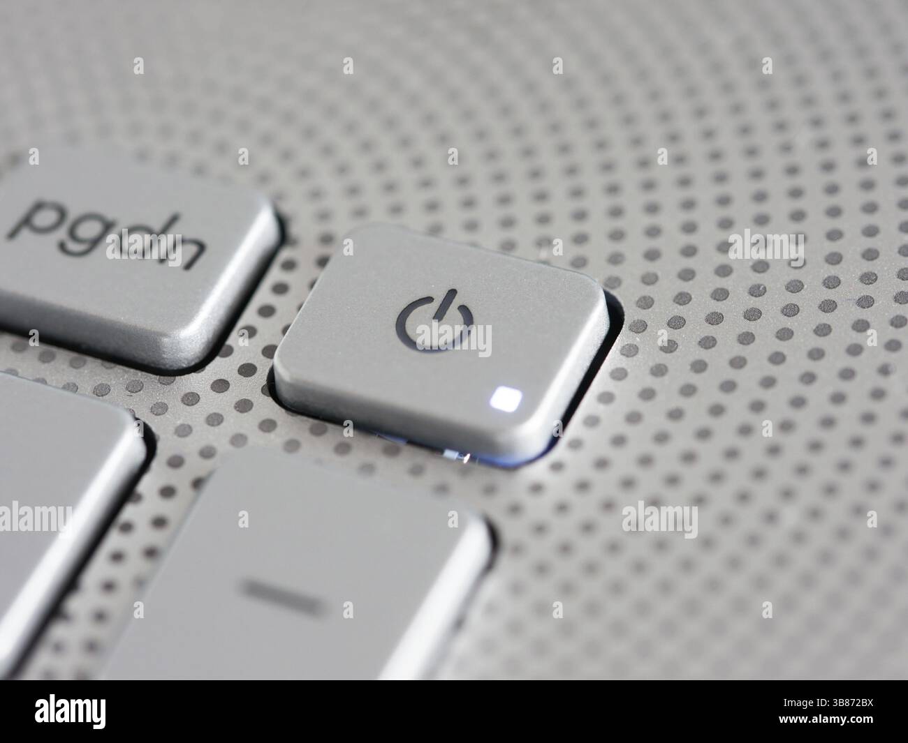 Silver laptop power button close up. Shallow DOF Stock Photo - Alamy