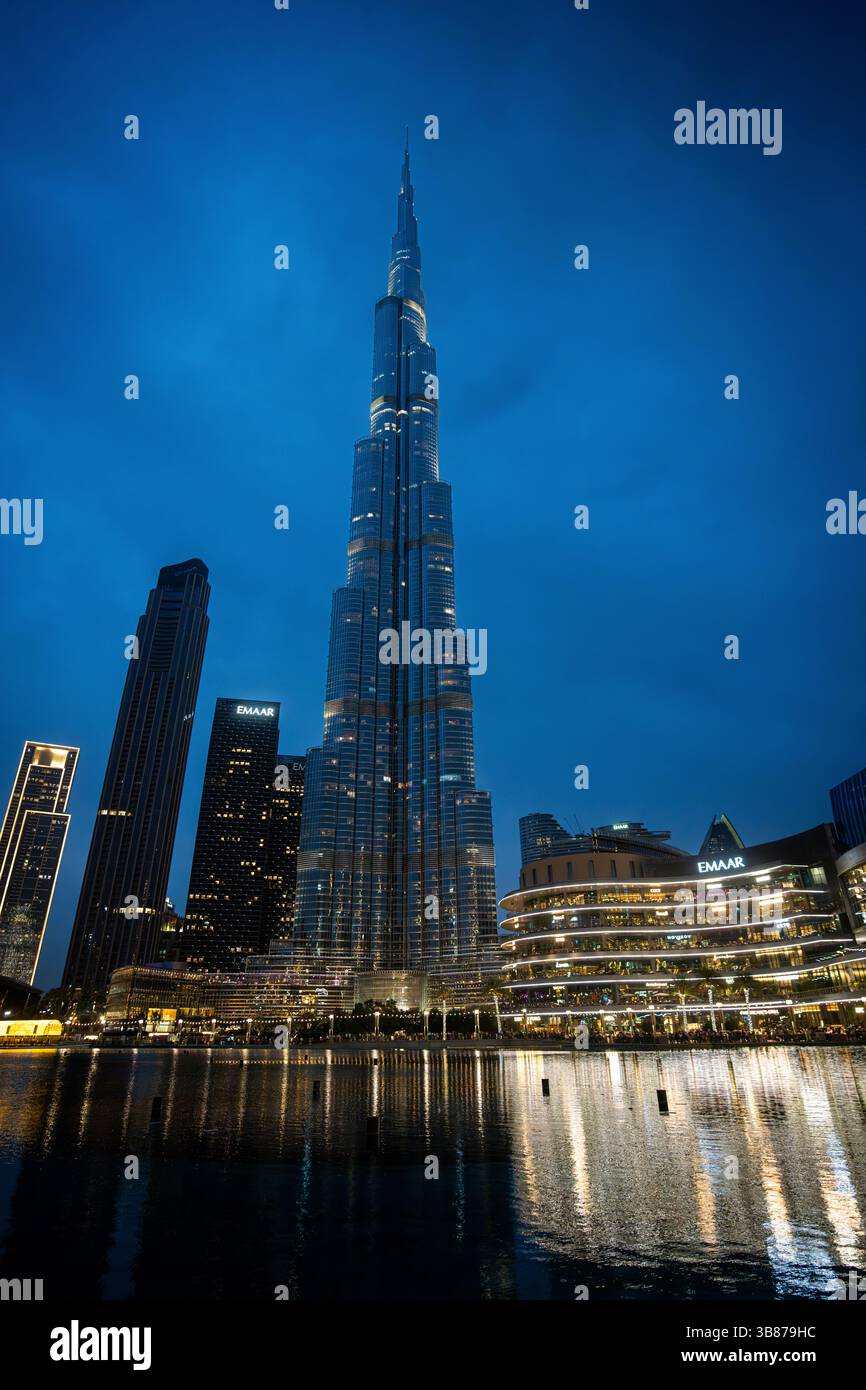 Burj Al Arab at night reflected in water with lights Stock Photo
