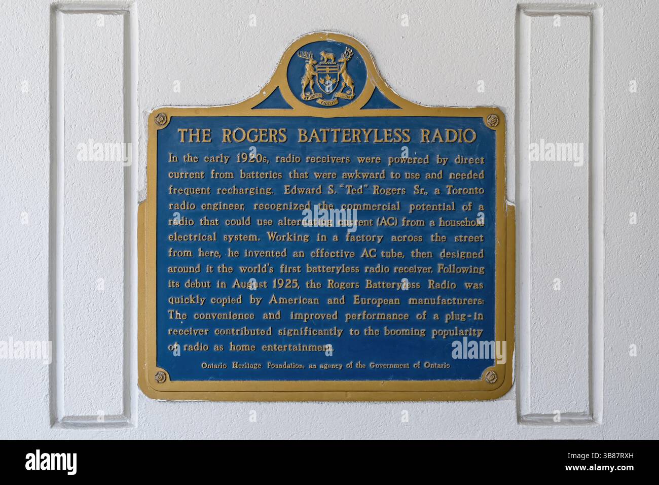 Historic information plaque about the Rogers Batteryless Radio, located on a building at 69 Chestnut Street. Stock Photo