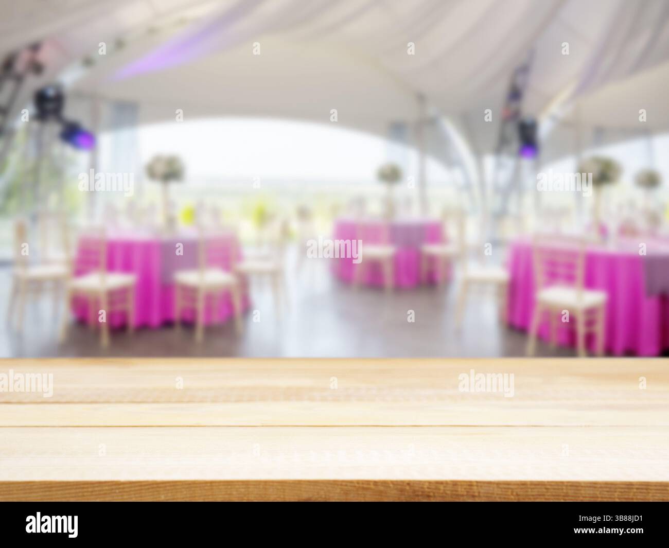 Light wooden empty table in front of blurred restaurant interior ...