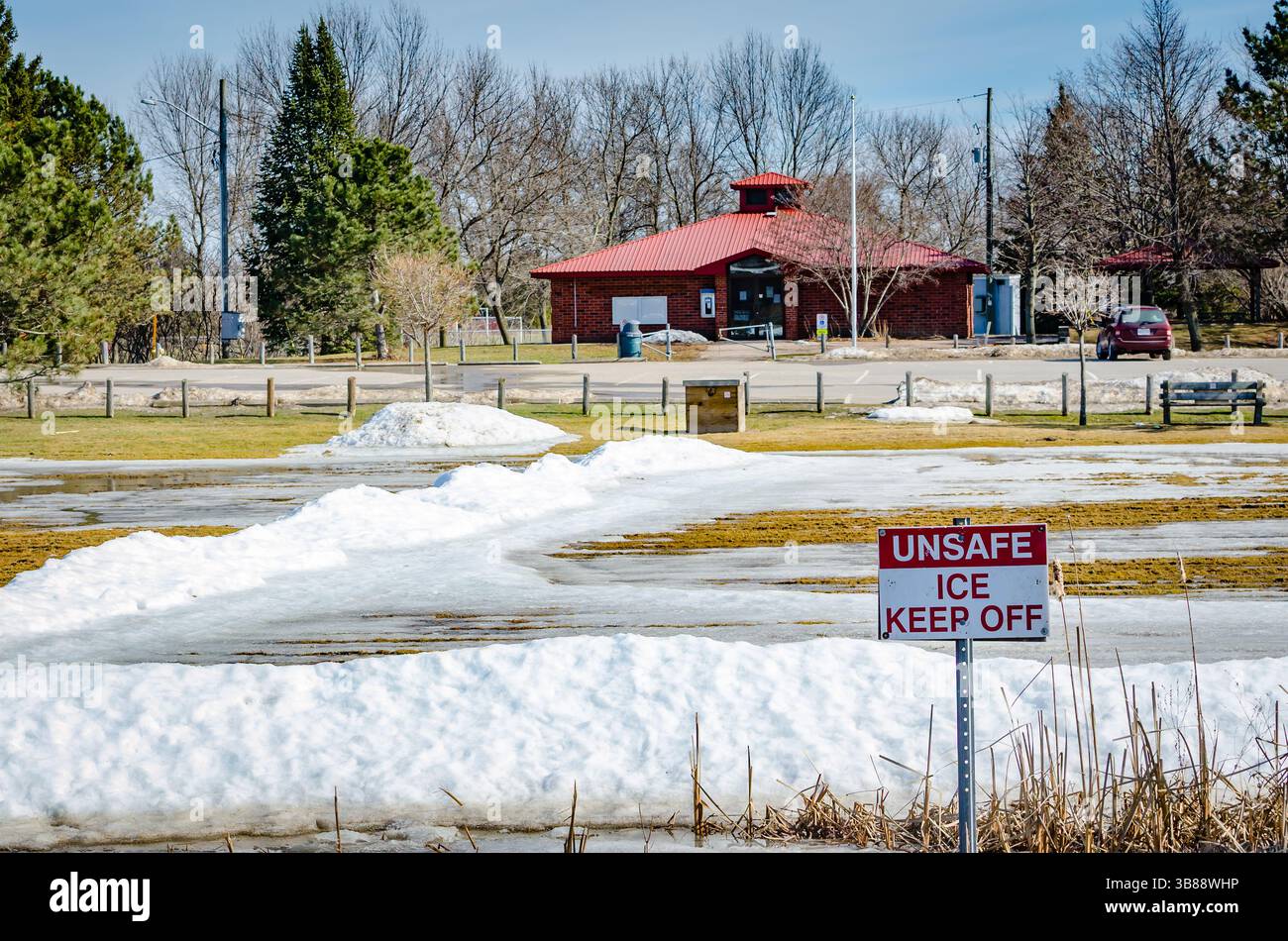 Melted outdoor ice rink at a community center with an