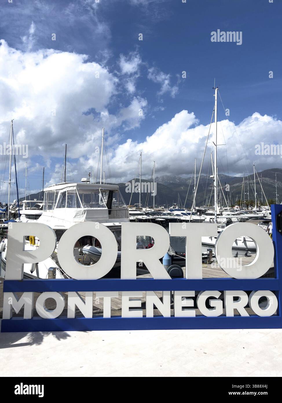 Tivat, Montenegro - 11 august 2023: Sign on the shore near the yachts. Caption: Porto, Montenegro, Europe Stock Photo
