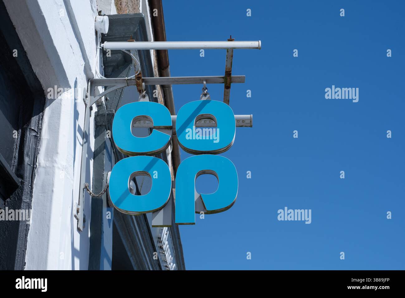 Co-op logo in the form of signage outside a branch of the supermarket chain in Crail, Fife, Scotland.  The Co-op is a food retail business. Stock Photo