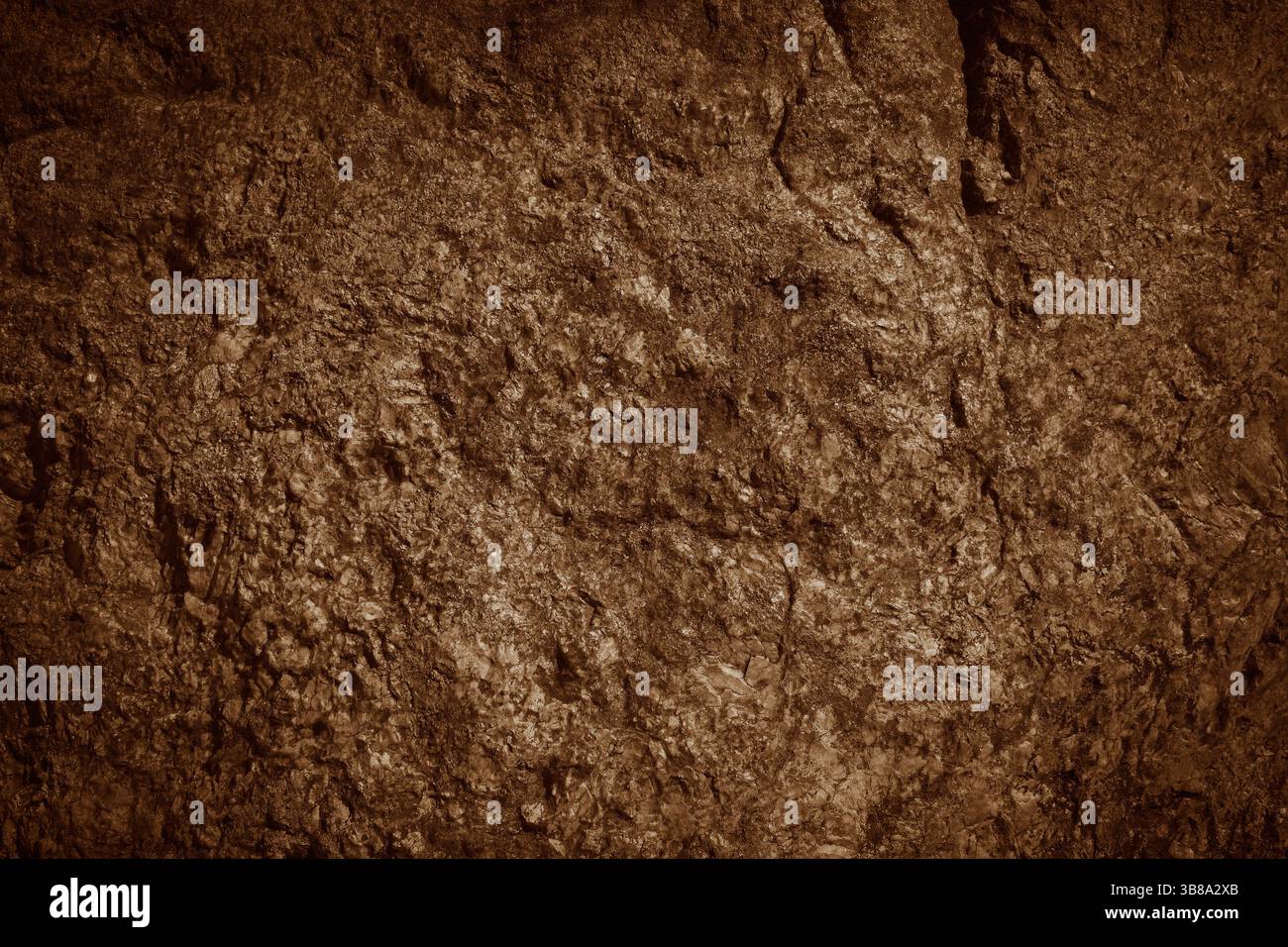 Brown rocky surface texture. Brown natural stone mountain background. Stock Photo