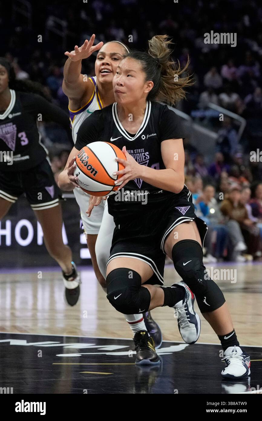 Wnba Chen Golden State Valkyries guard Kaitlyn Chen, right, drives to the basket ...