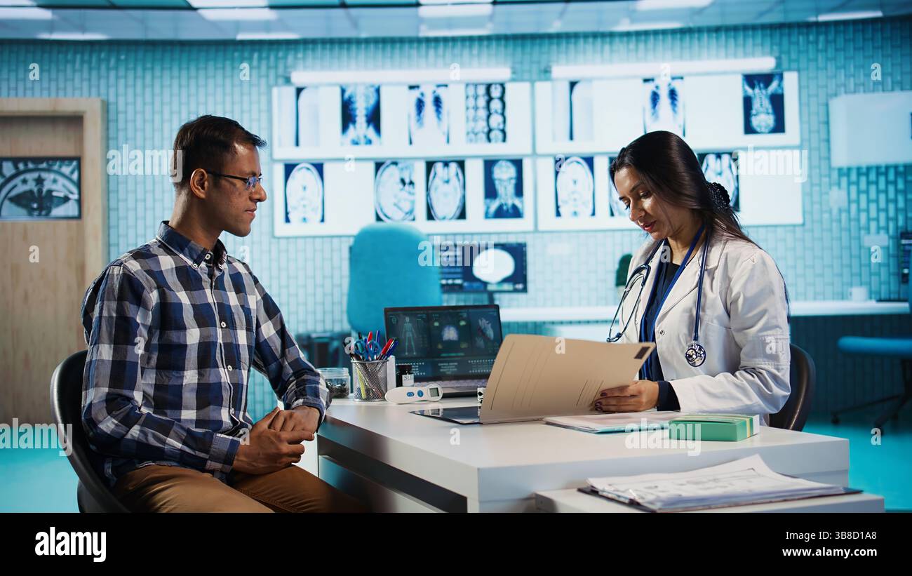 Physician meeting with patient to discuss medical test results in a ...