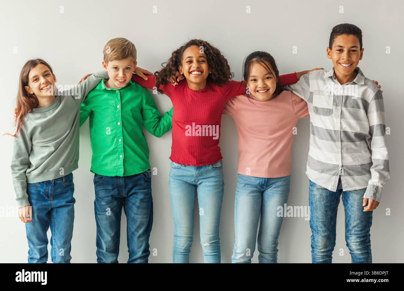 Similing Kids Cheerful Multiethnic Children Hugging Posing Smiling To Camera Indoors ...