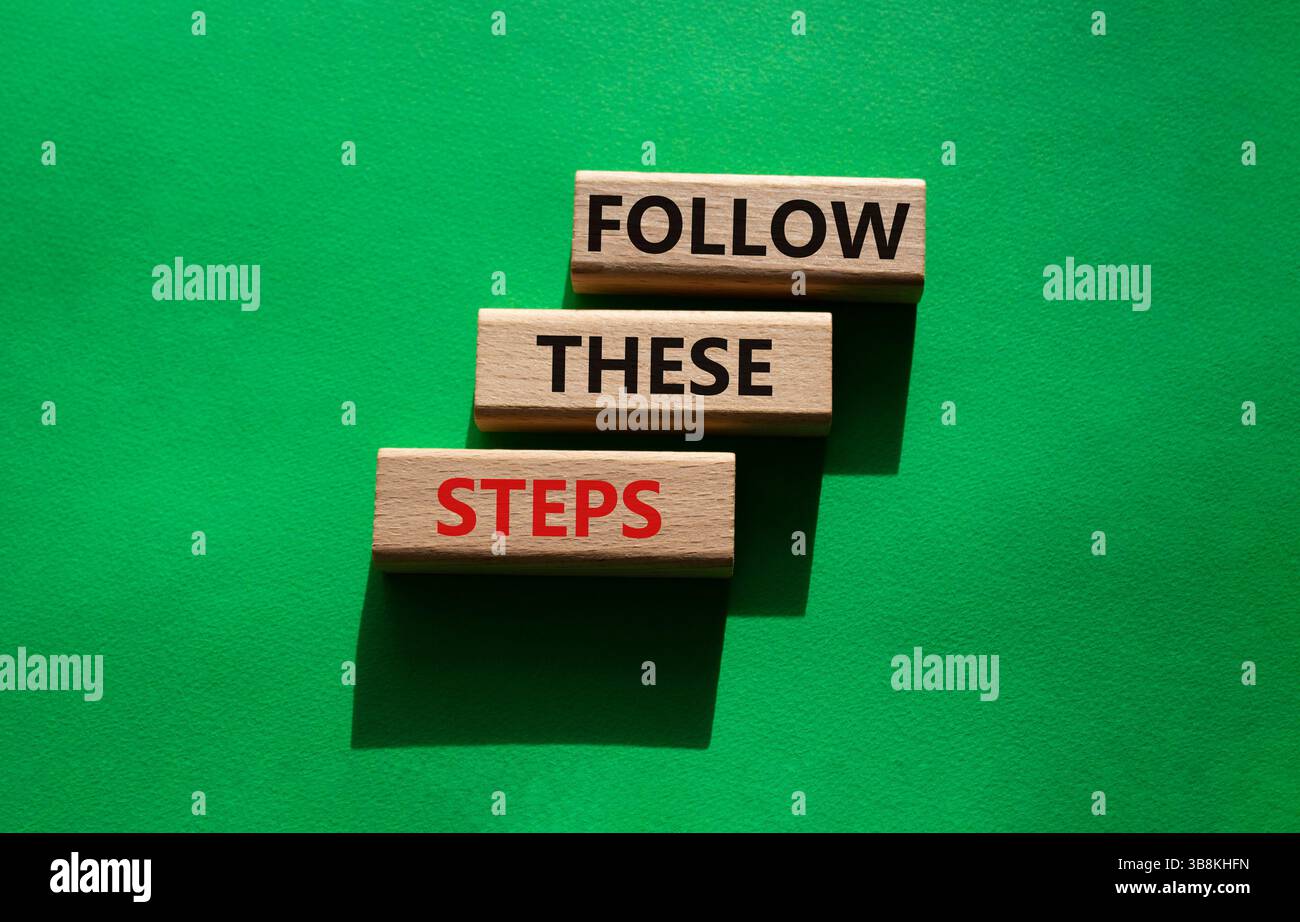 Follow these steps symbol. Wooden blocks with words Follow these steps ...