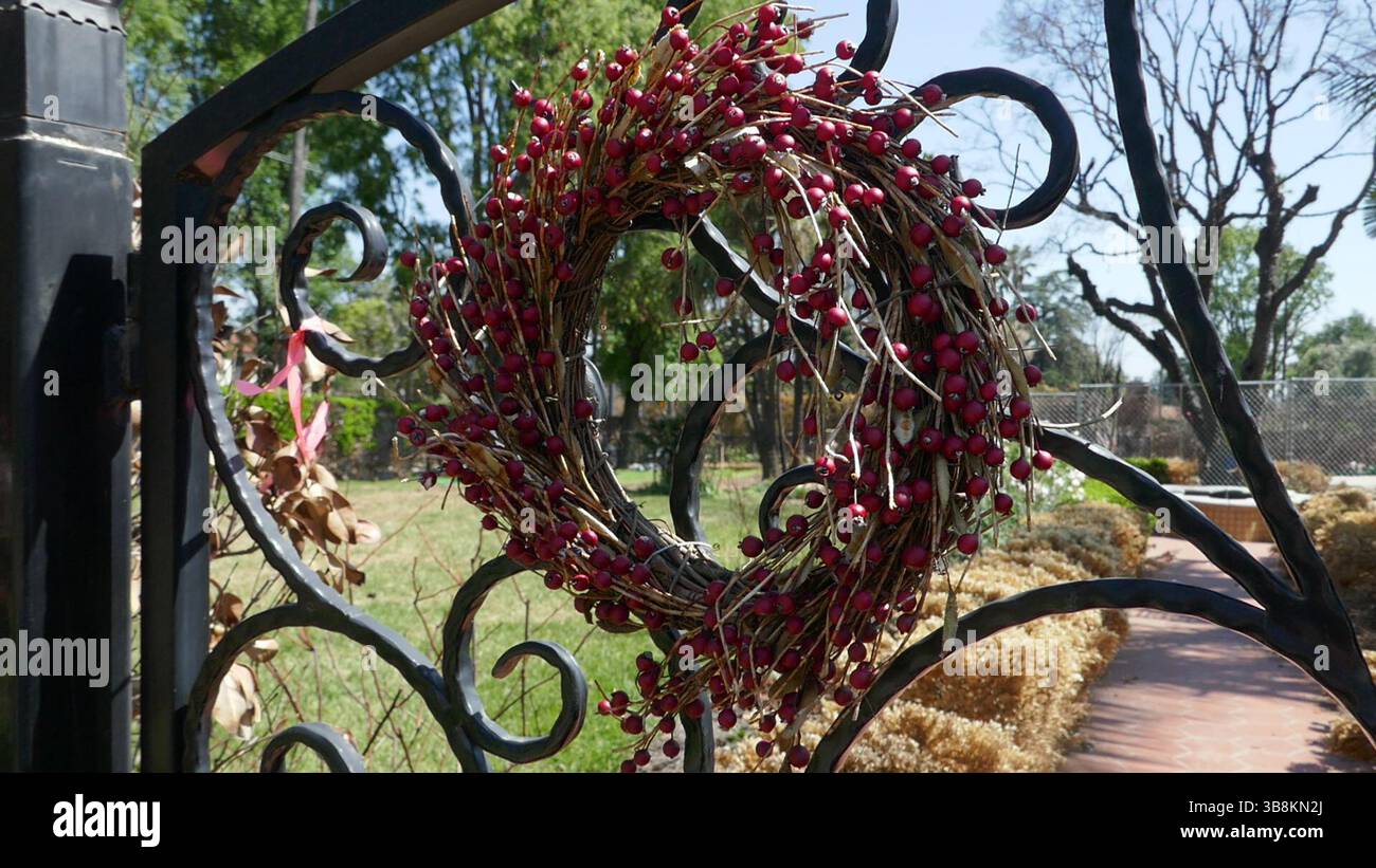 Altadena, California, USA 7th May 2025 Christmas Wreath on gates at ...
