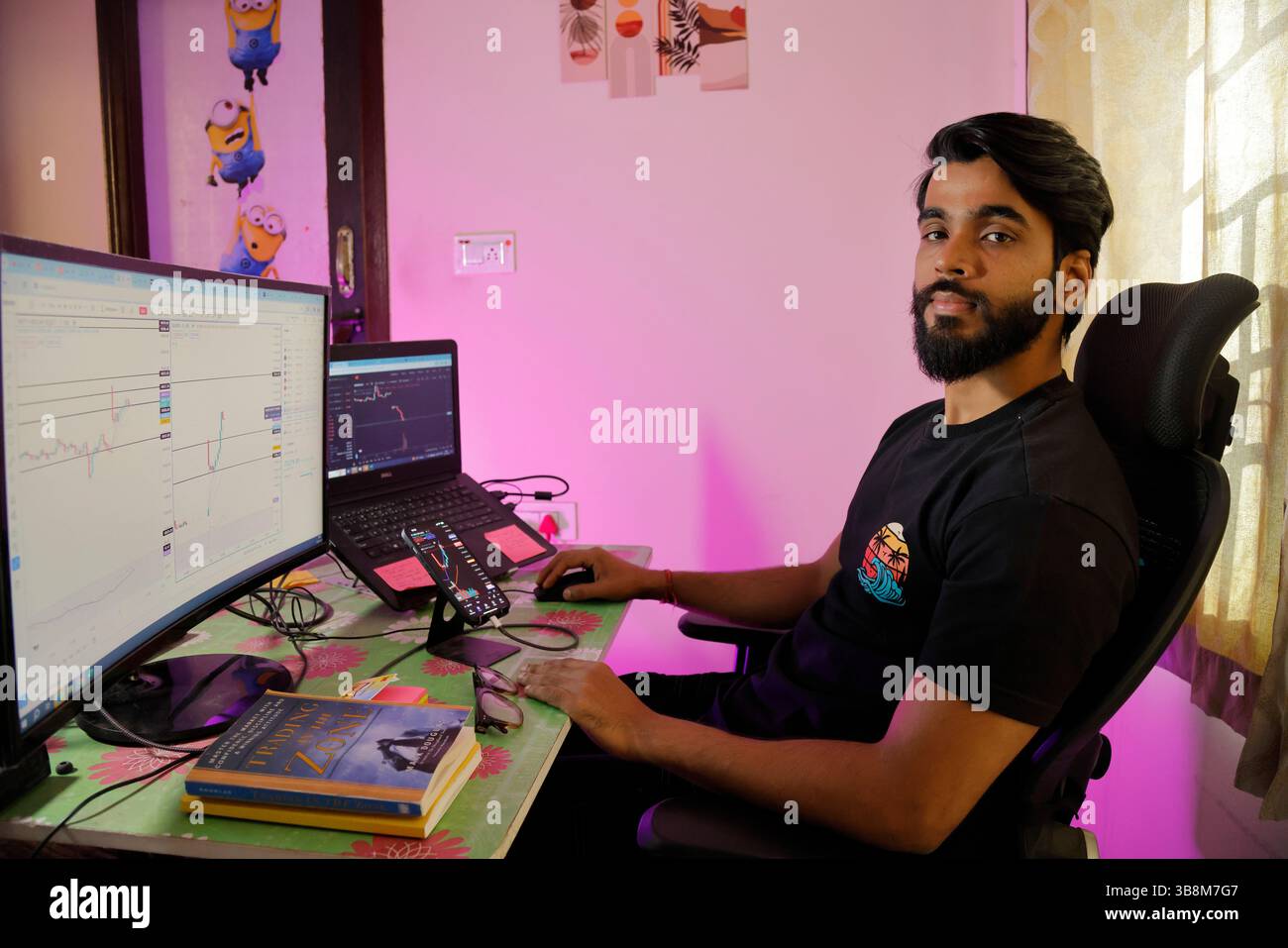 January 12, 2024, Bengaluru: 12Jan2024 - Bengaluru- INDIA..Love Pulkit at his Home Stock Trading Setup desk.He is a budding Stock market options trader. Initially after having lost heavily in the stock market options trades, he has started recovering and making steady profits in options trading. (Credit Image: © Subhash Sharma/ZUMA Press Wire) Stock Photo