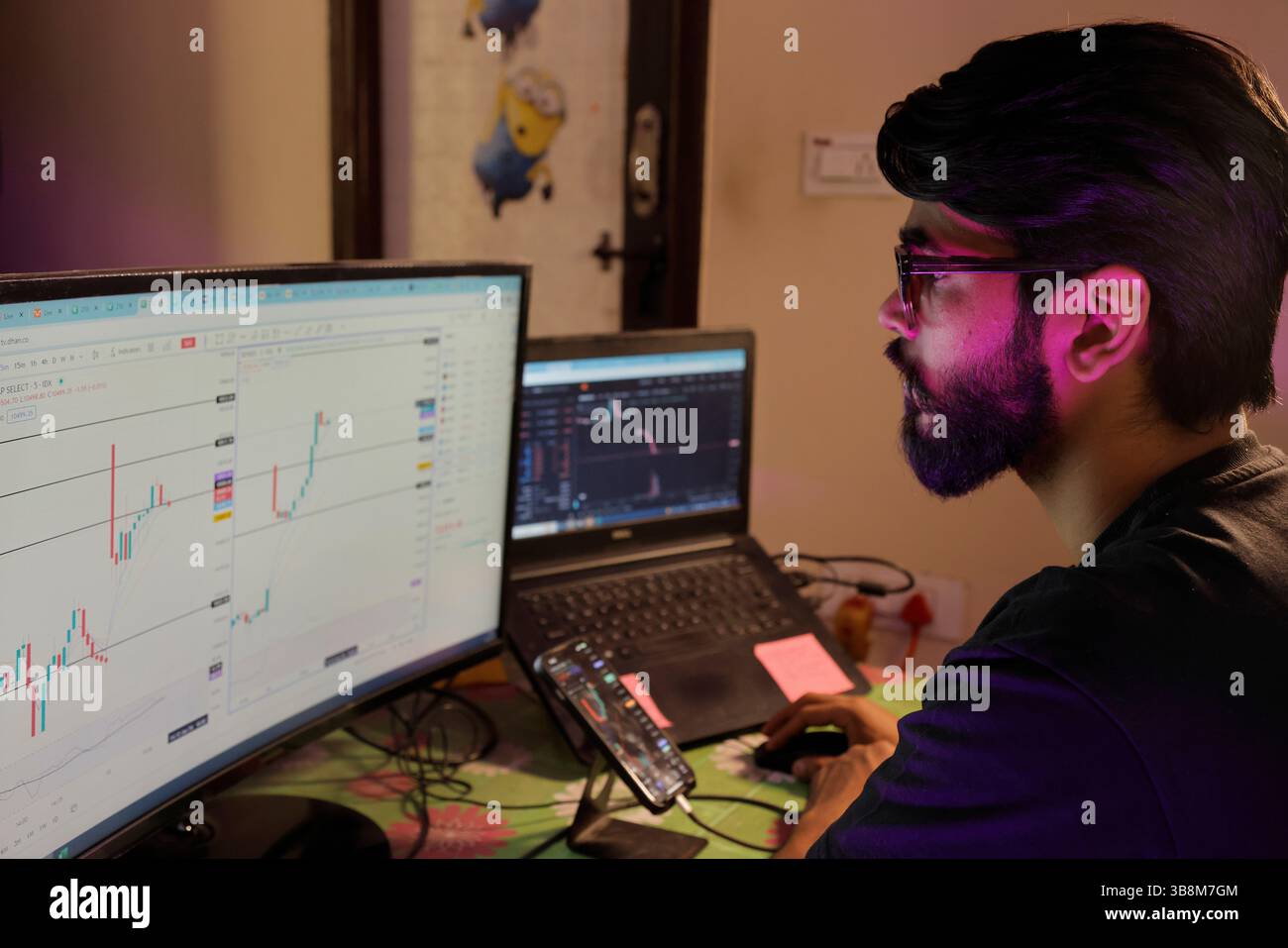 January 12, 2024, Bengaluru: 12Jan2024 - Bengaluru- INDIA..Love Pulkit at his Home Stock Trading Setup desk.He is a budding Stock market options trader. Initially after having lost heavily in the stock market options trades, he has started recovering and making steady profits in options trading. (Credit Image: © Subhash Sharma/ZUMA Press Wire) Stock Photo