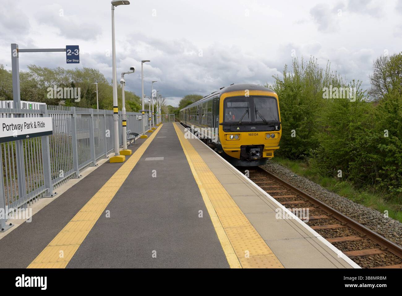 Great Western Railway train arriving at Portway Park and Ride Railway Station, April 2025 Stock Photo