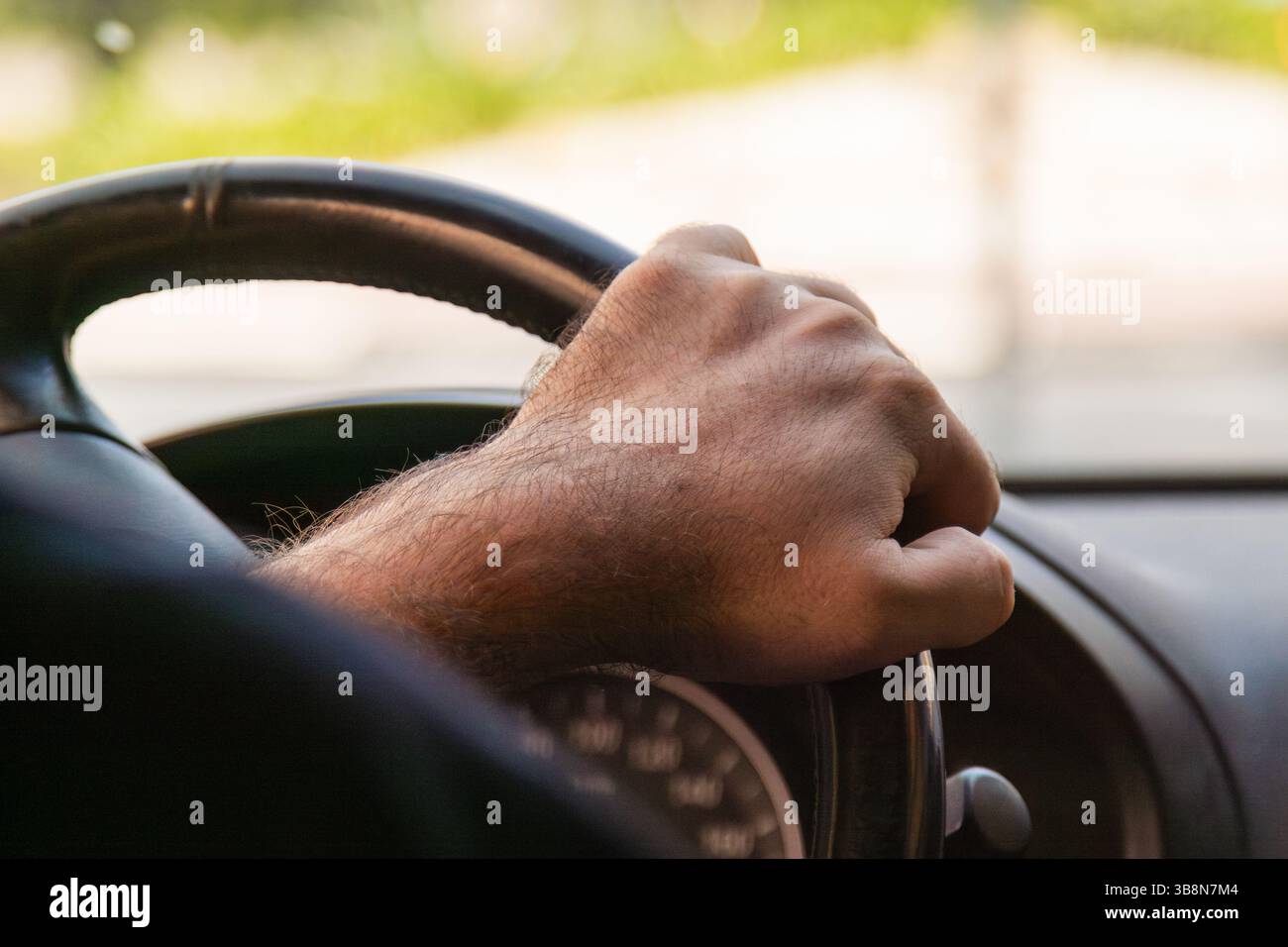 Hand holding steering wheel hi-res stock photography and images - Alamy