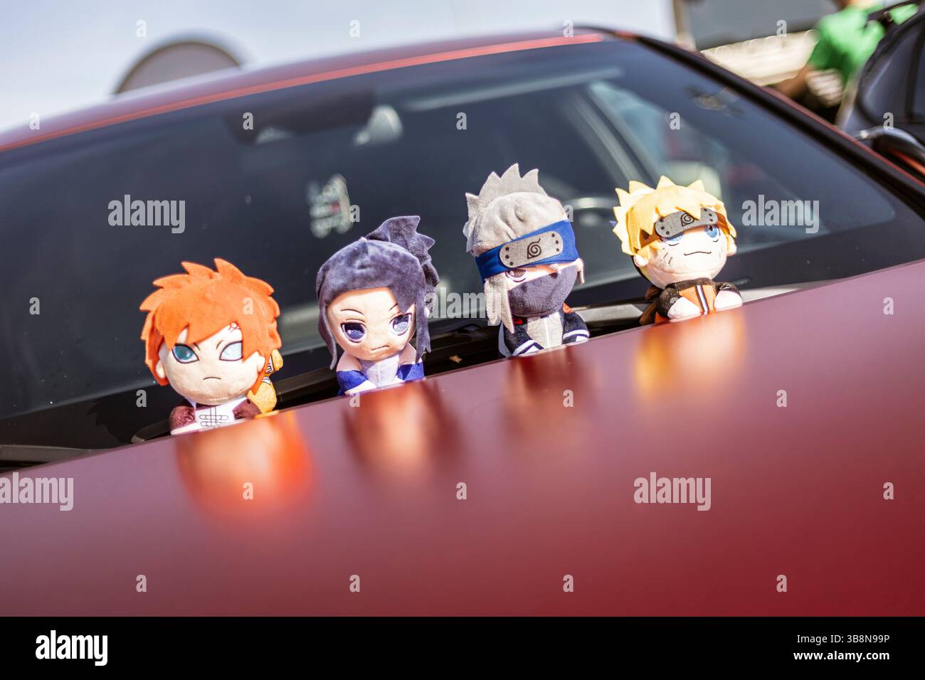 Rome, italy 4 may 2025: four naruto plushies perched on a car dashboard, happily enjoying the ride and adding a touch of playful charm to the interior Stock Photo