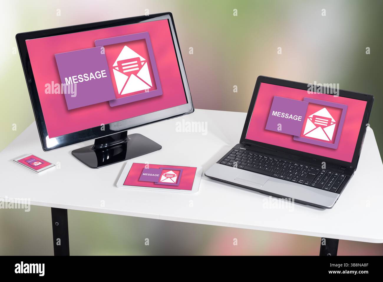 Message concept shown on different information technology devices Stock Photo