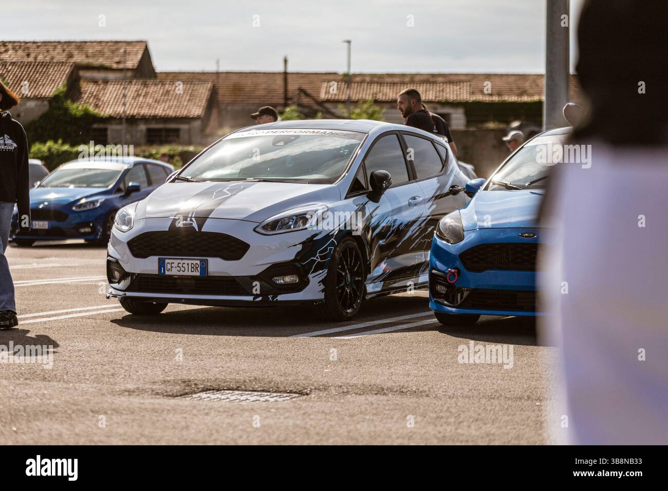 Rome, italy 4 may 2025: mechanics preparing customized ford fiesta ...