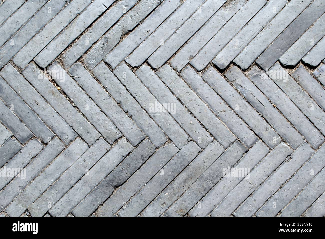 Bricks tiles in a Herringbone pattern textured abstract background Stock Photo