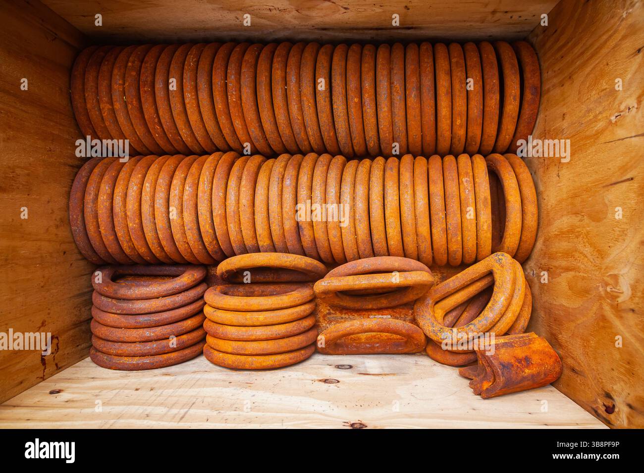 Rusty steel rings stacked in a box for securing loads, top view Stock ...