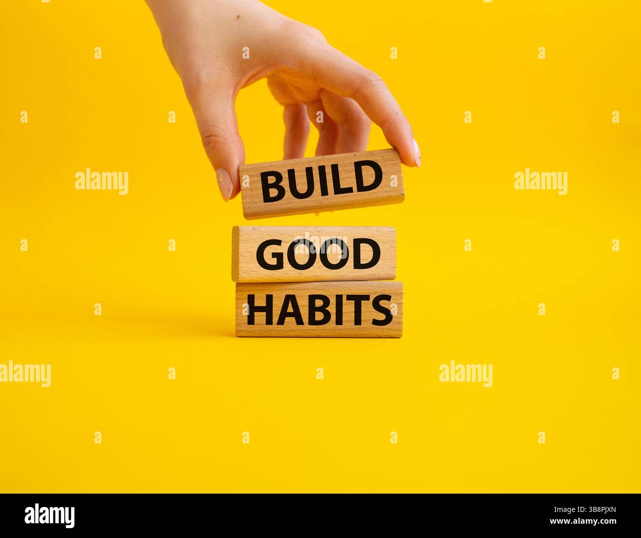 Build good habits symbol. Wooden blocks with words 'Build good habits ...