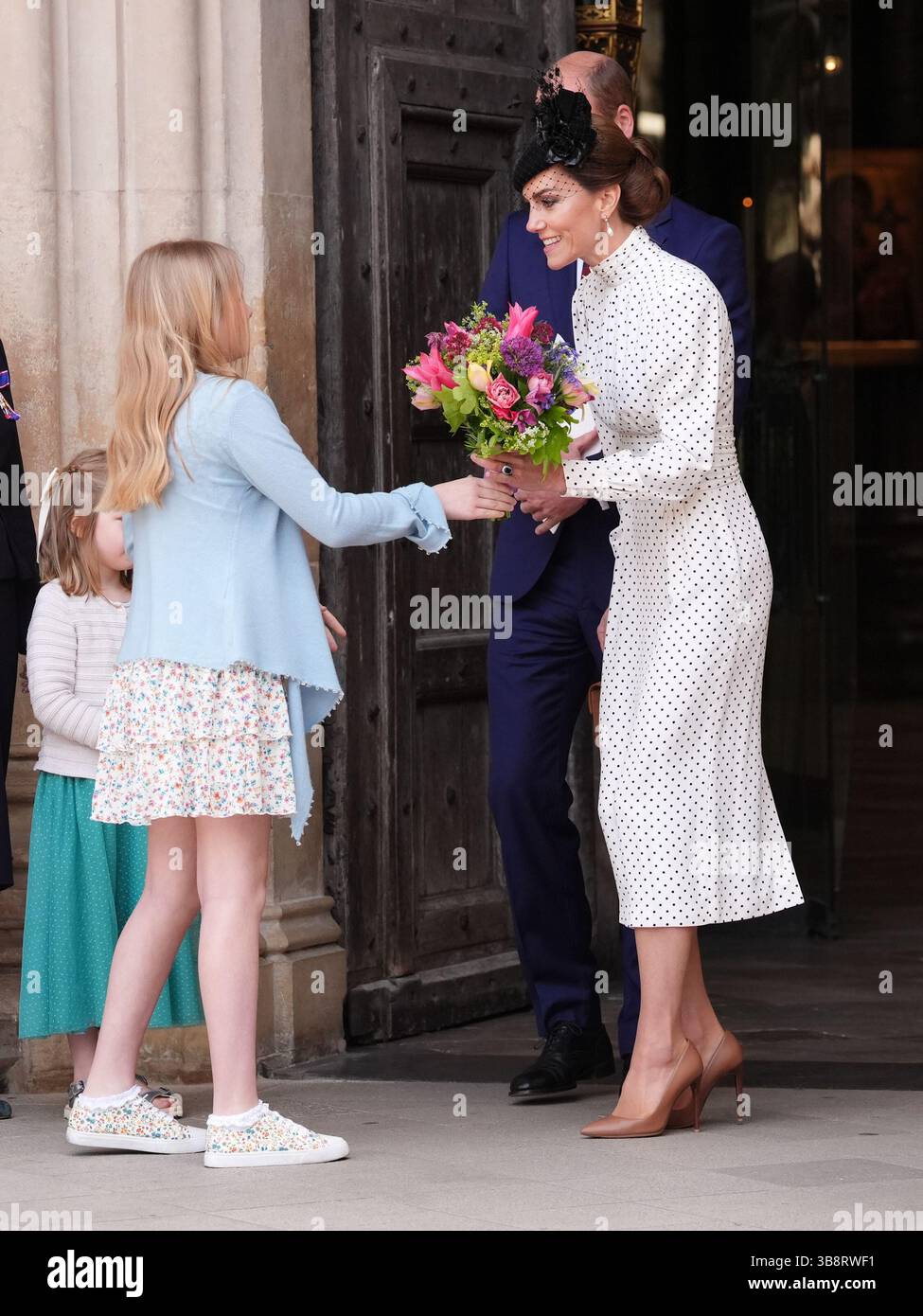 The Princess of Wales receives flowers as she leaves after attending a ...