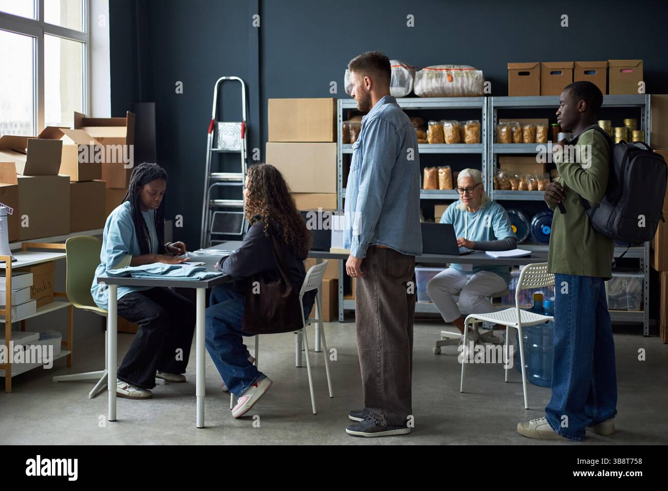 Collaborating in Modern Warehouse Office Environment Stock Photo