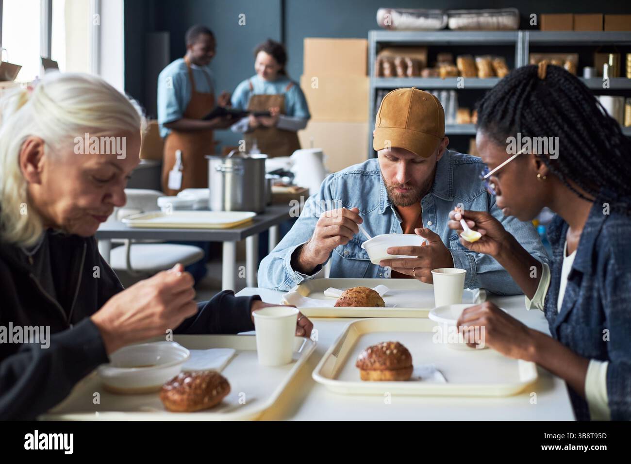 Enjoying Lunch Break in Cafeteria Setting Stock Photo