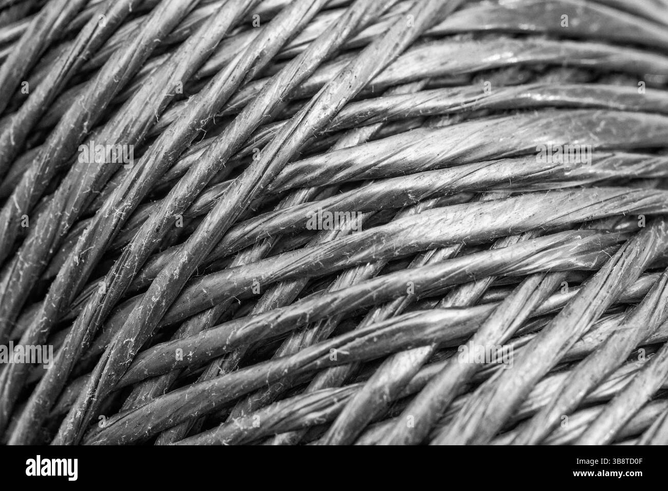 Close shot of a new roll of polypropylene garden twine / sting. Converted to monochrome (see Notes). For gardening, or pulling strings perhaps. Stock Photo