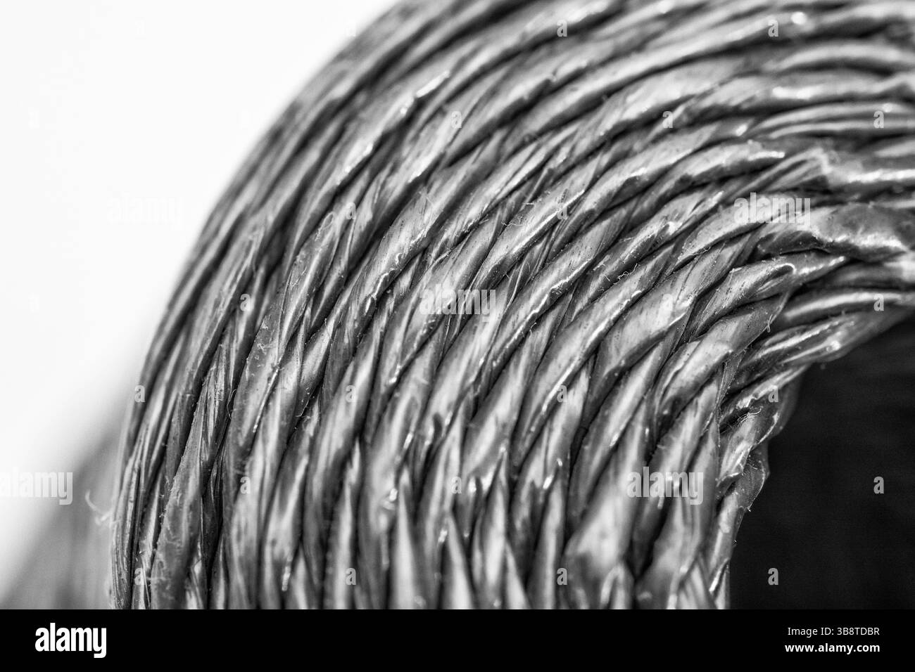Close shot of a new roll of polypropylene garden twine / sting. Converted to monochrome (see Notes). For gardening, or pulling strings perhaps. Stock Photo