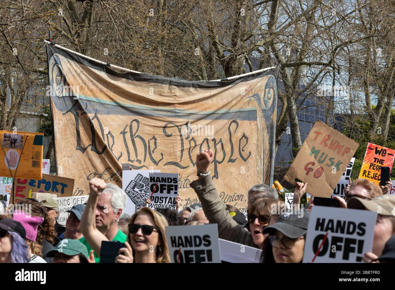 Hundreds protesters and supporters gather at Seattle Center for the “Hands Off!” rally in Seattle on Saturday, April 5, 2025. The protest is part of a Stock Photo