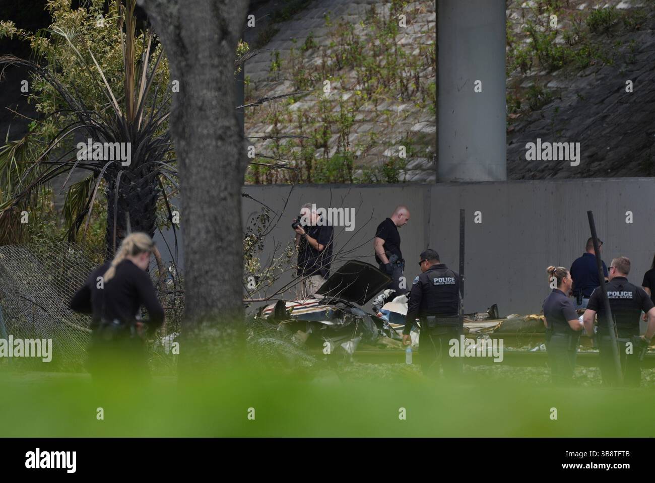 Emergency personnel respond to the area where a small plane crashed on ...