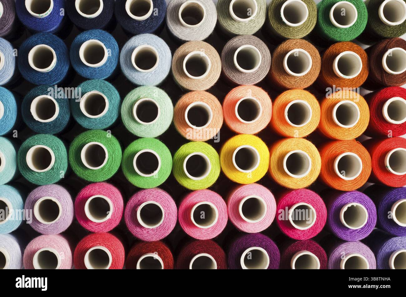 Sewing threads as a multicolored background close up Stock Photo