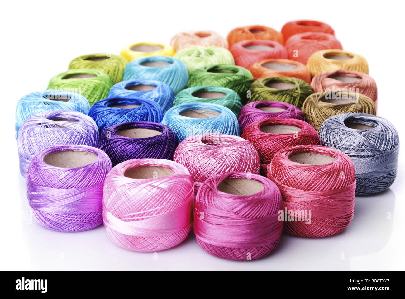Coloured threads on bobbins hi-res stock photography and images - Alamy