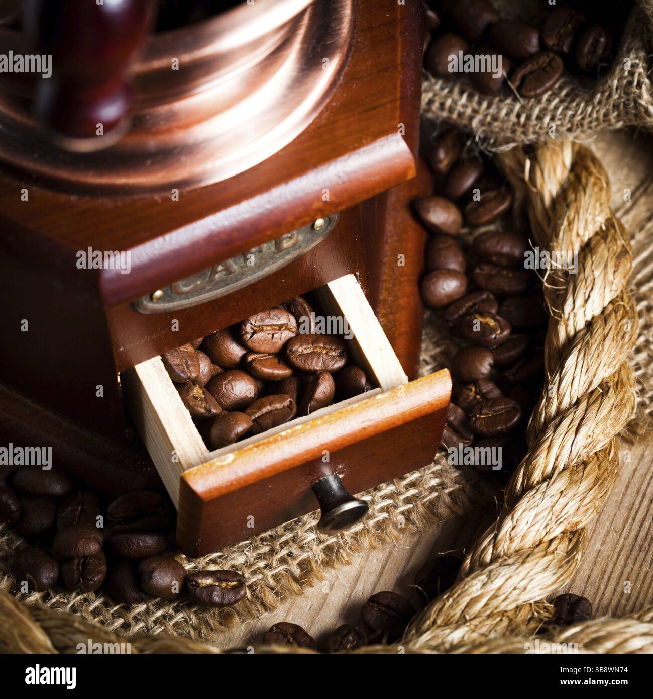 Coffee in grinder and rope still life Stock Photo