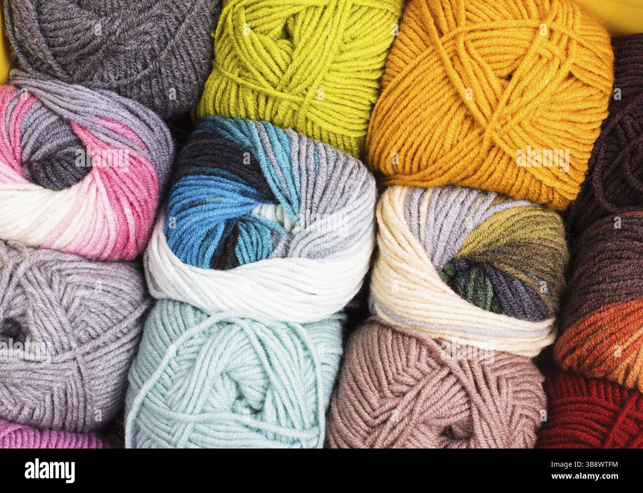 Various colors threads on rows in the store Stock Photo