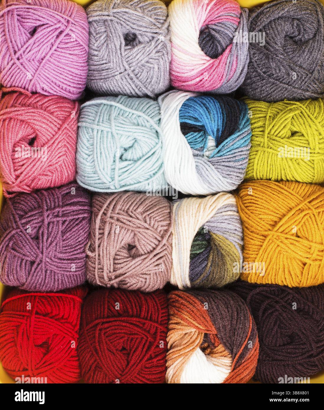 Various colors threads on rows in the store Stock Photo