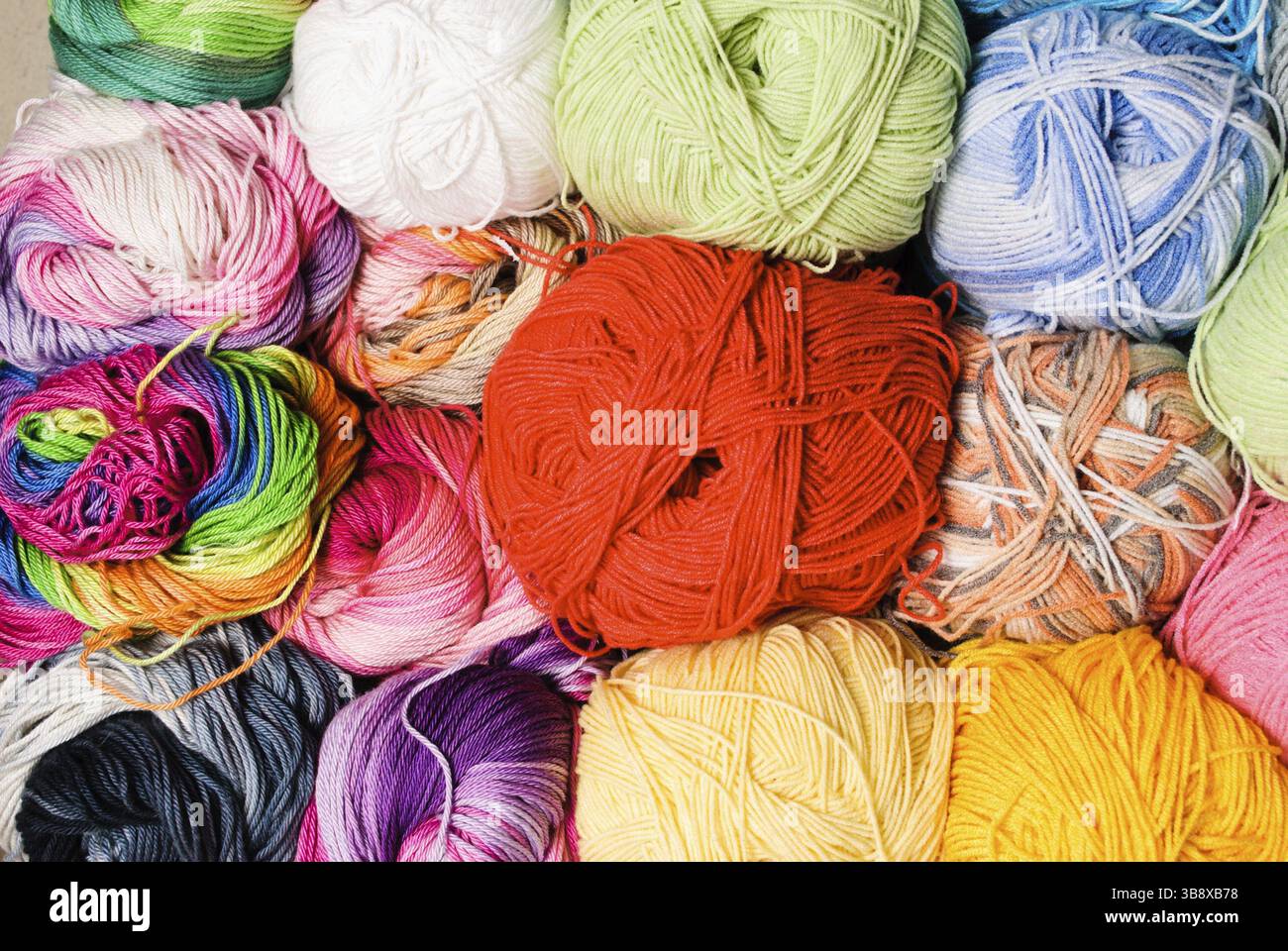 Different color threads on rows in the store Stock Photo