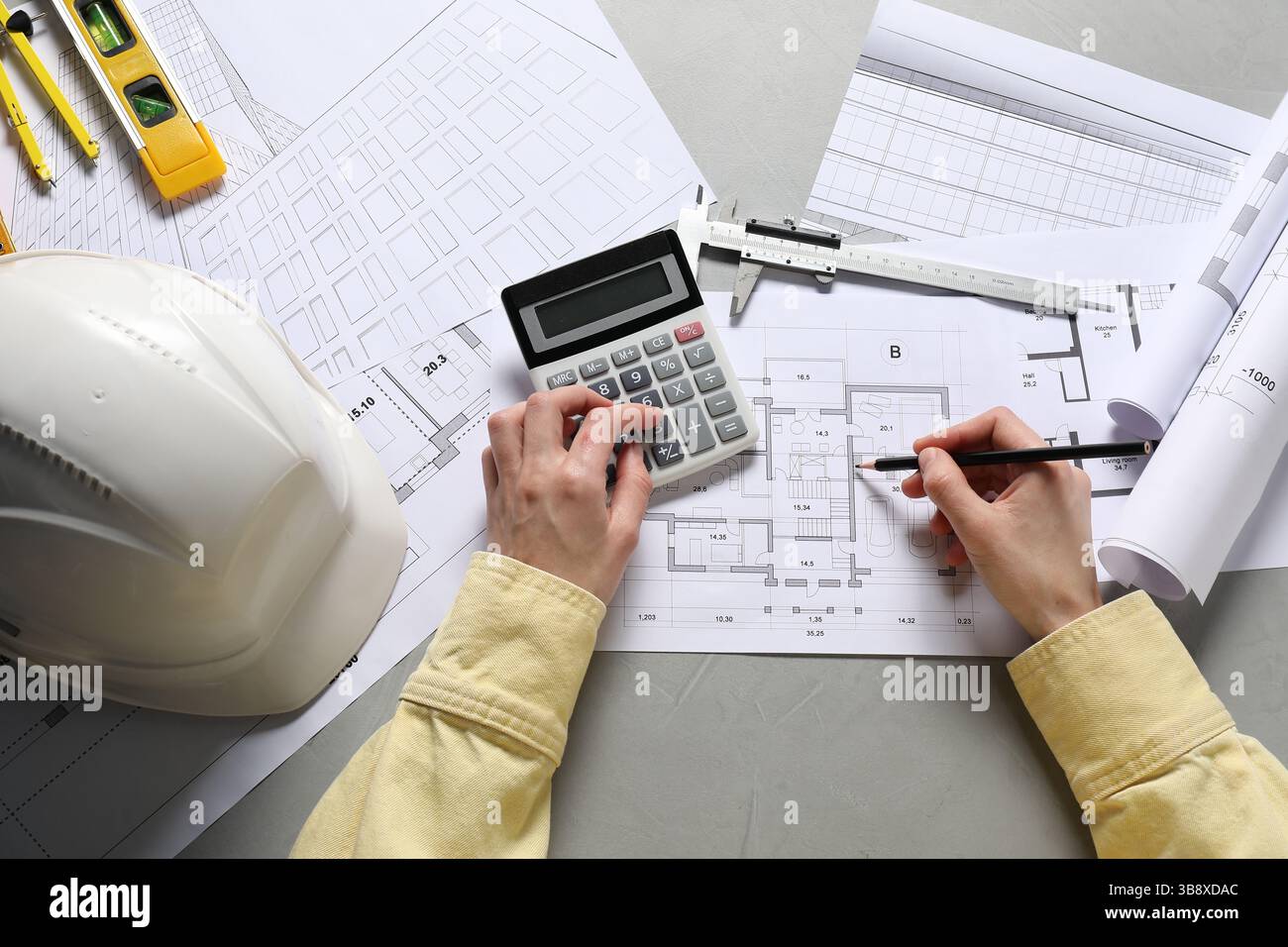 Architect working with project, top view. Different technical drawings ...