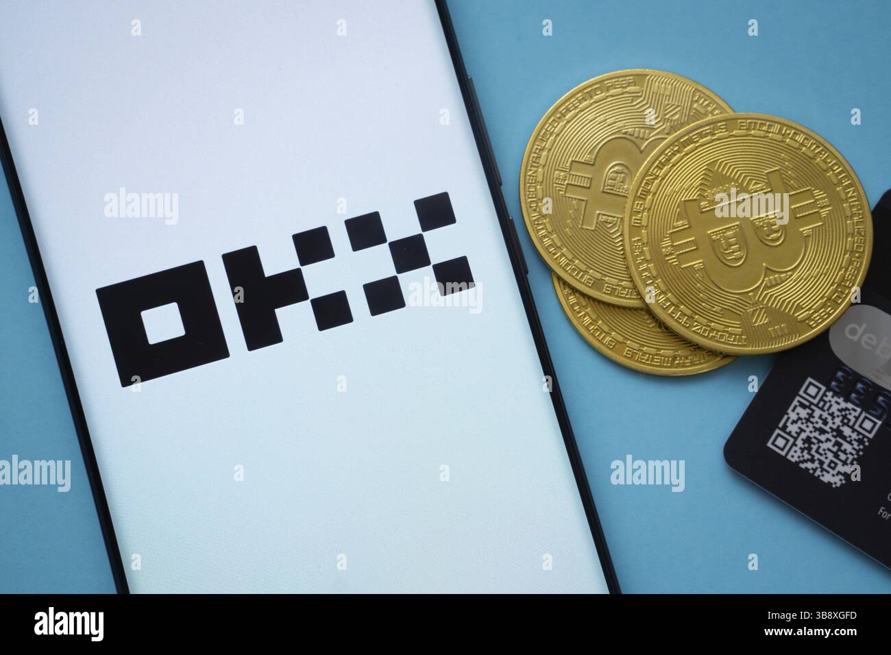 Dhaka, Bangladesh - 04 April 2025: The logo of the OKX is displayed on a smartphone screen. OKX is the second largest cryptocurrency exchange platform Stock Photo