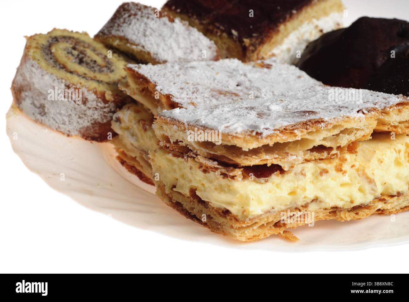 Various cakes on white plate isoleted on white background Stock Photo