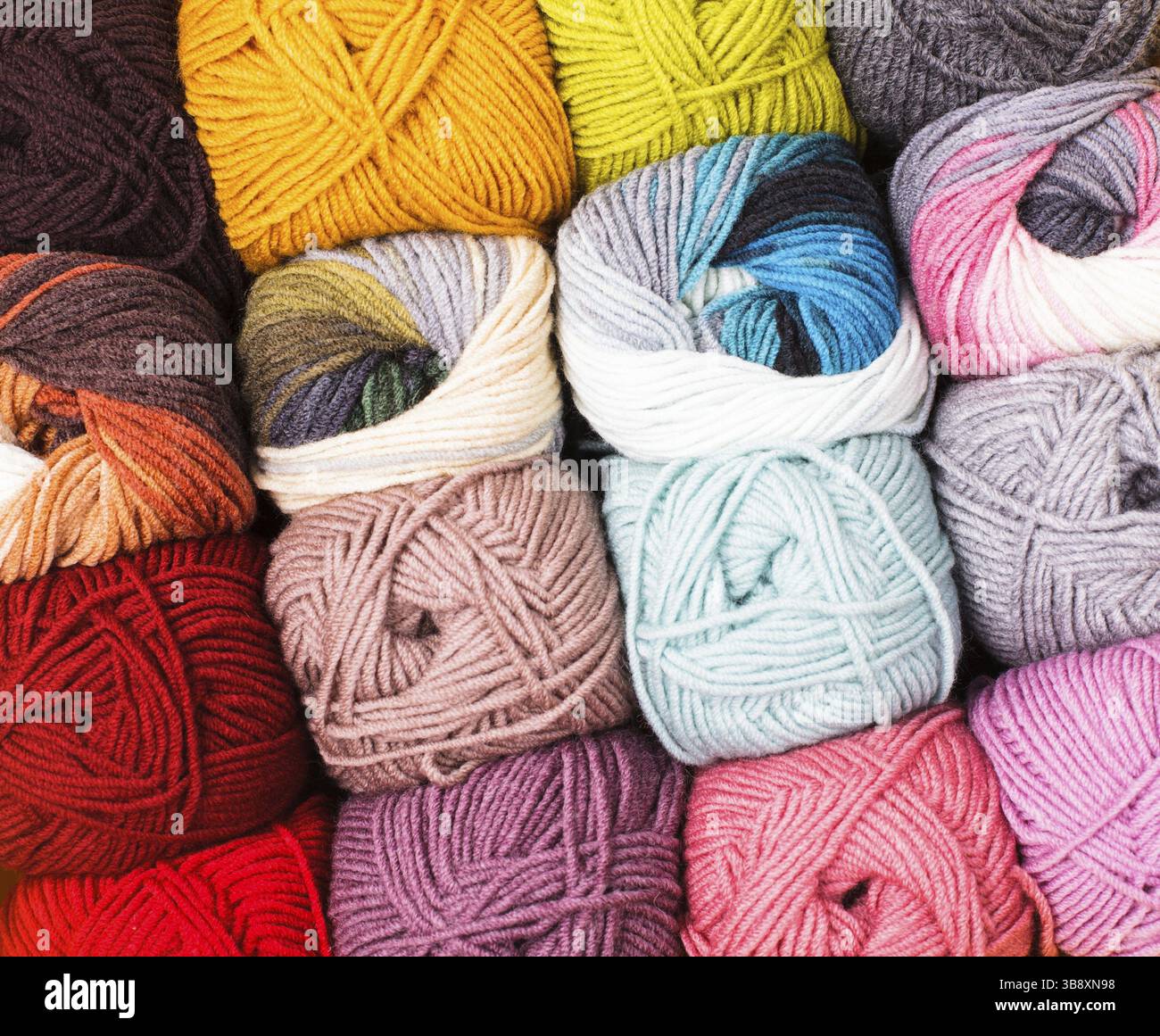 Various colors threads on rows in the store Stock Photo