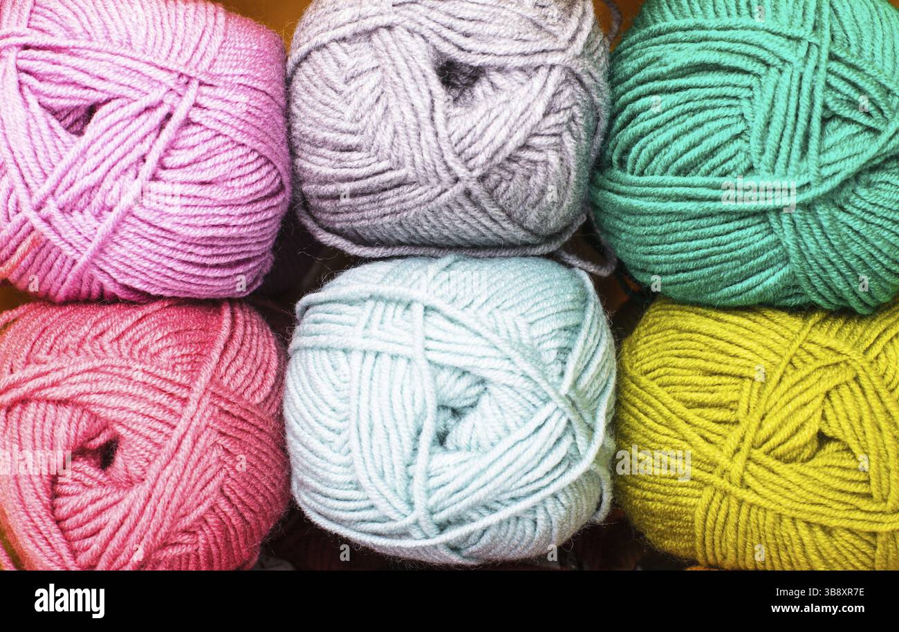 Various colors threads on rows in the store Stock Photo